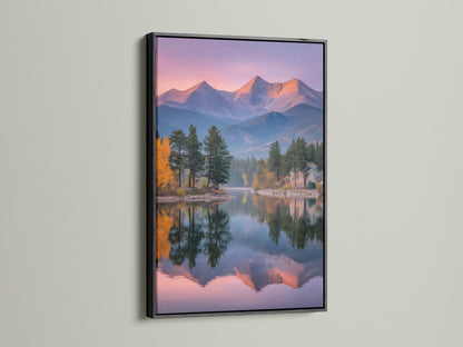 A black frame highlights this mountain lake canvas artwork. The landscape print features a stunning mountain reflection. This scenic artwork complements lodge style interiors. The black frame adds a touch of sophistication to the serene wall art.