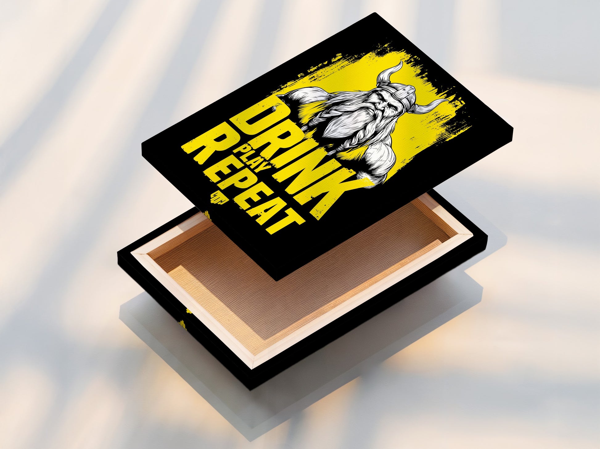 This image showcases a stretched canvas print of the Viking Warrior. This Nordic mythology art is perfect for man cave decor. The stretched canvas offers a gallery-ready look. It highlights the Drink Play Repeat artwork. This print is a must-have for any gaming or gym space.