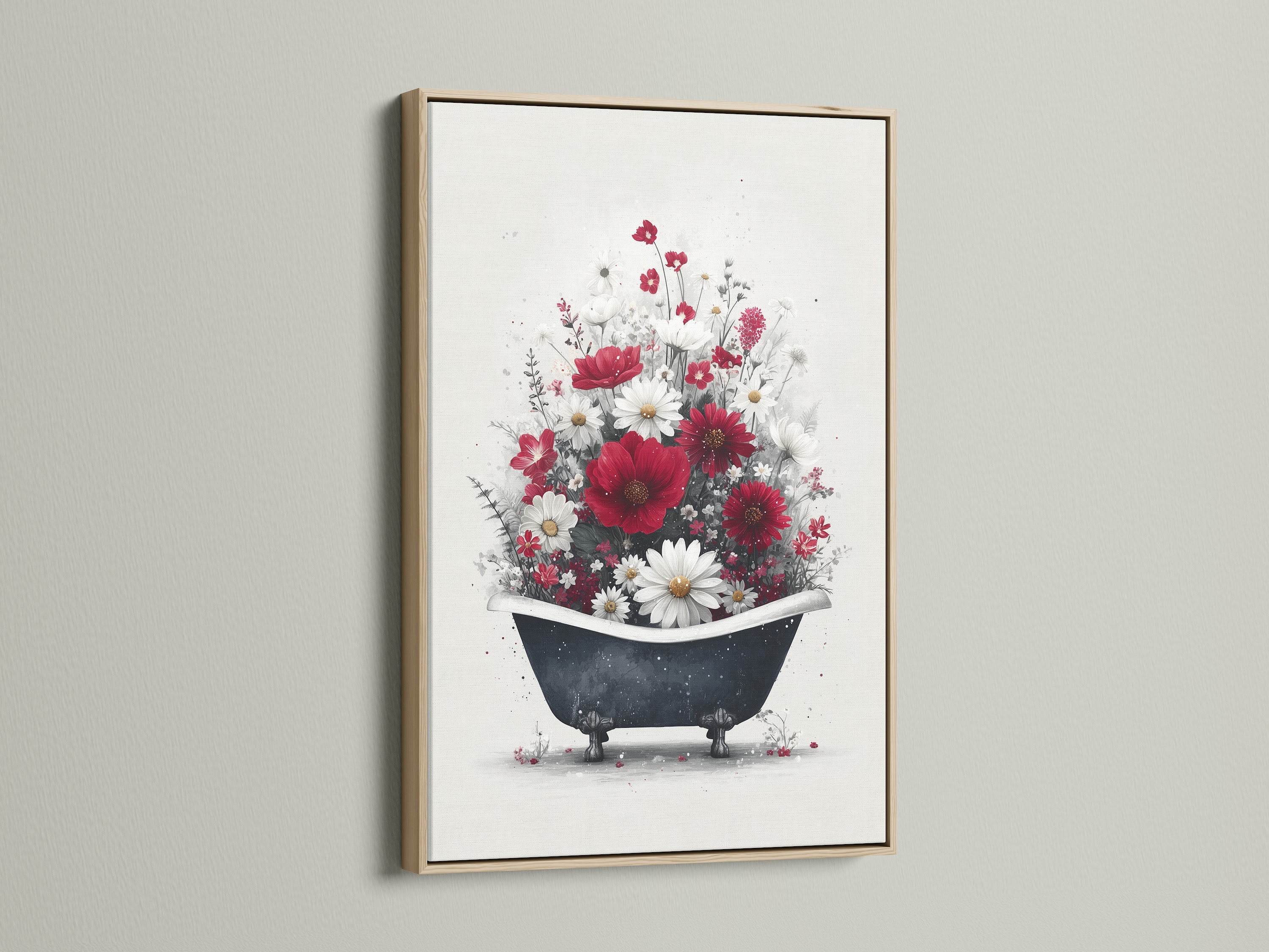 A framed floral bathtub artwork hangs on a white wall. This artwork showcases red and white flowers in a vintage bathtub. An oak frame is used in this version. Ideal farmhouse wall art for rustic vintage or country decor. Add a unique touch to your bathroom or spa.
