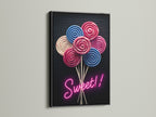 Lollipop Candy Canvas Print with a Black Frame. This modern art print features pink and blue lollipops. Perfect for adding a sweet touch to your walls. It is great for playrooms or as candy shop decor.