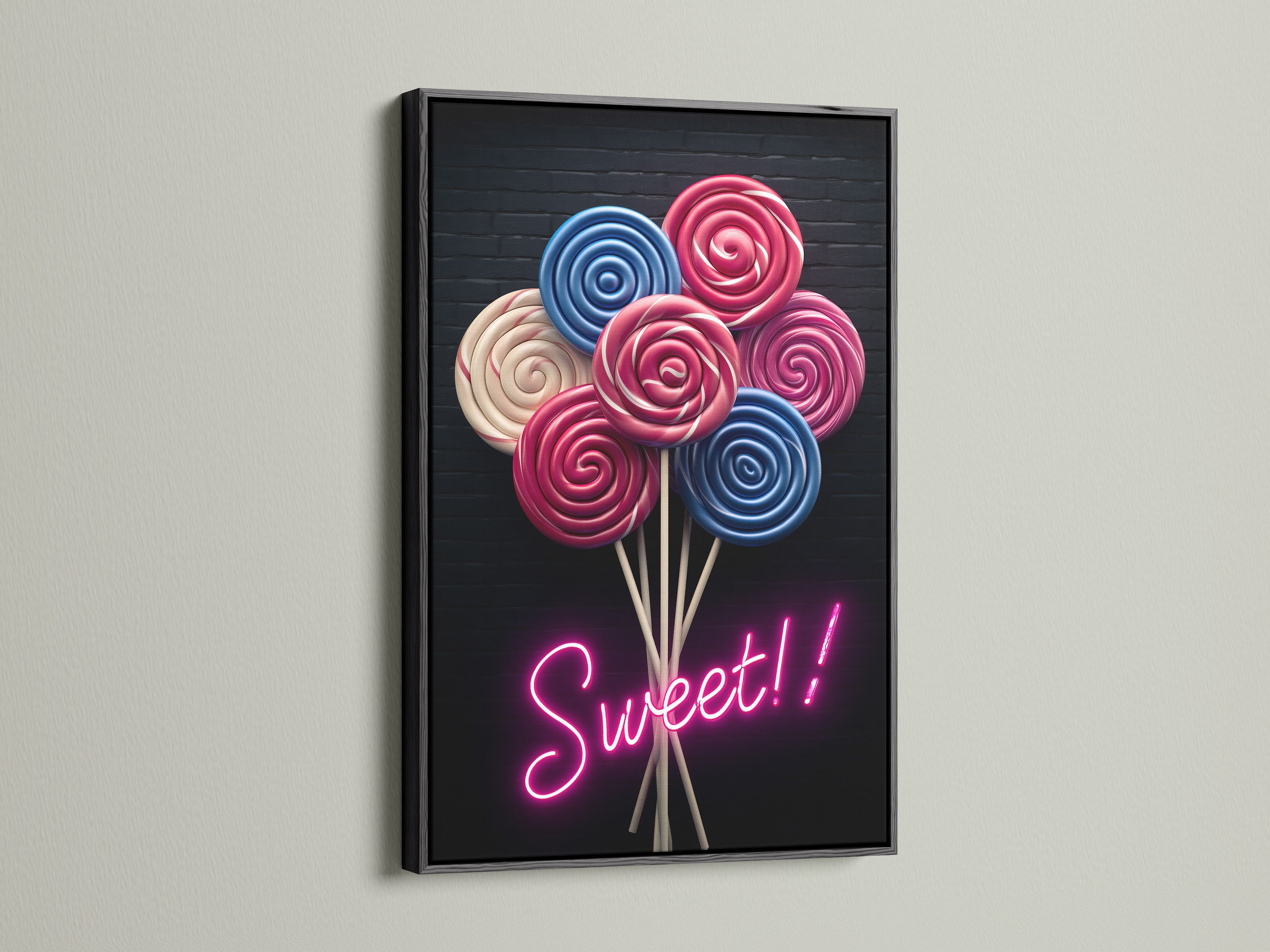 Lollipop Candy Canvas Print with a Black Frame. This modern art print features pink and blue lollipops. Perfect for adding a sweet touch to your walls. It is great for playrooms or as candy shop decor.