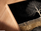 A close-up angled view reveals a canvas print in a floating frame. The Tree of Life artwork appears to hover adding depth to the nature wall decor. This unique framing style enhances the modern minimalist nature artwork for bedroom decor.