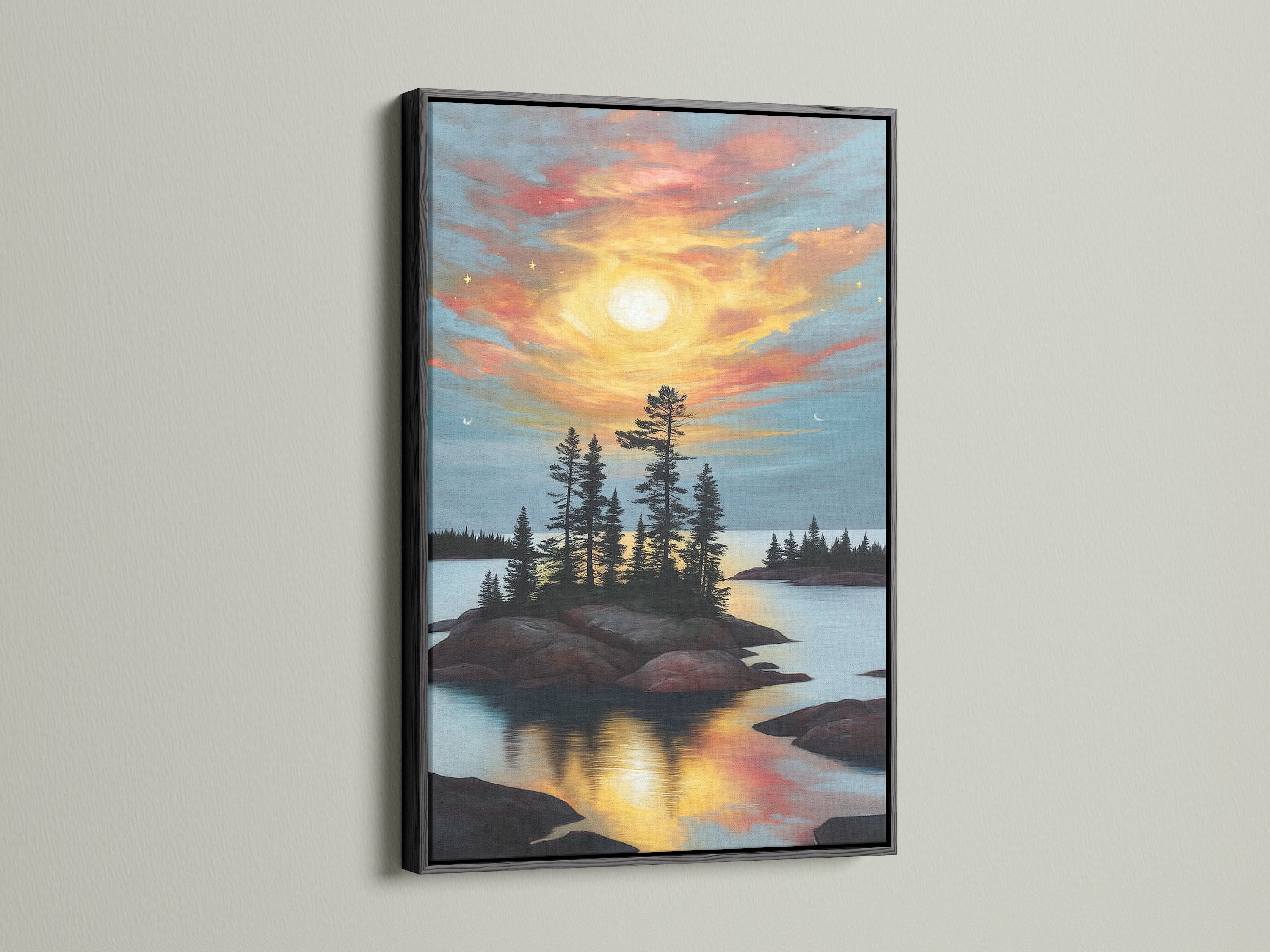 Lake Sunset Canvas Print in a sleek black frame. The warm tones of the sunset art contrast beautifully with the dark frame. This pine tree print adds a touch of nature to your home. A great addition to studios.