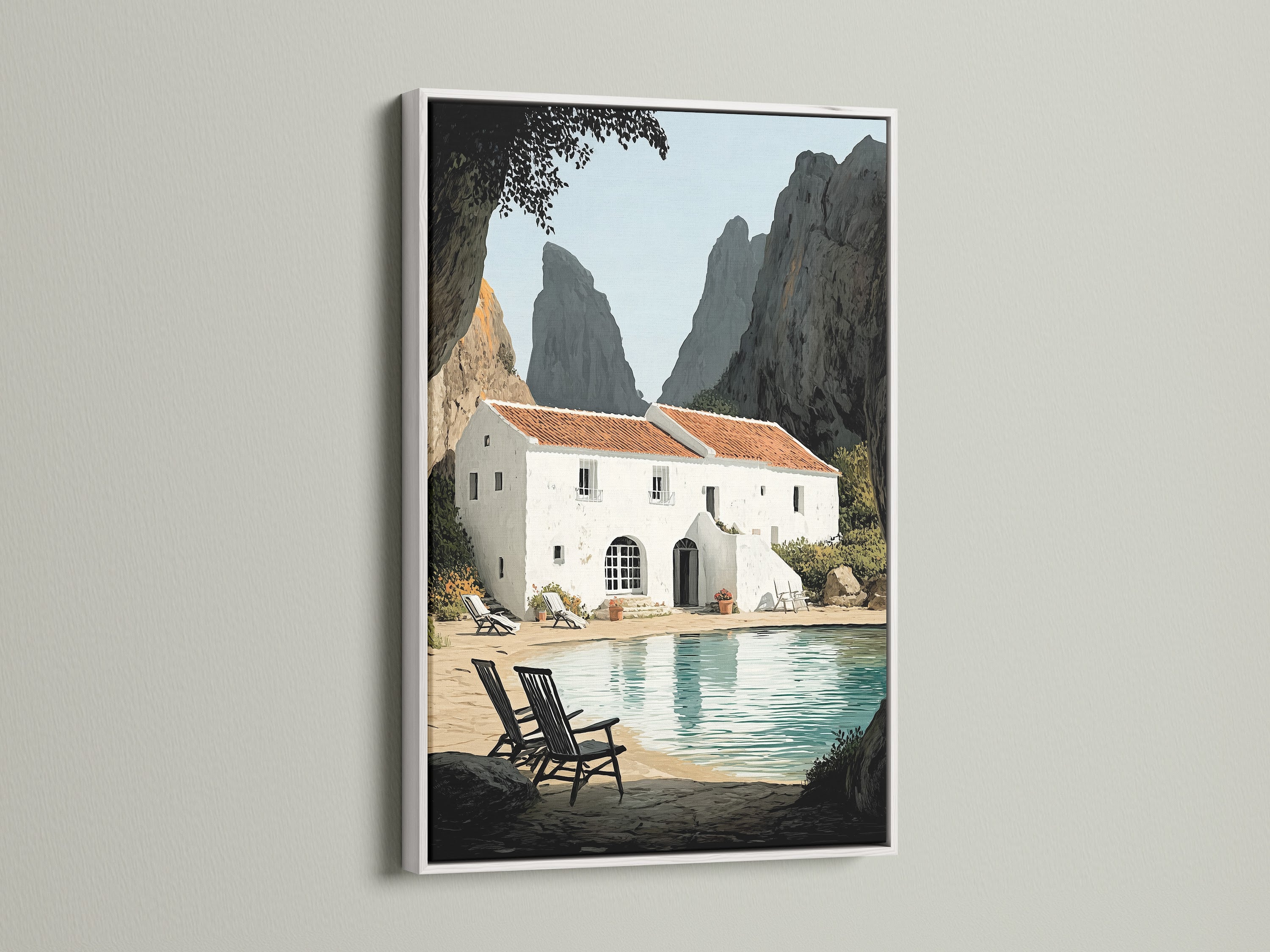 Framed coastal villa artwork with a white frame on a white wall. The bright frame enhances the seaside artwork. Ideal for a clean contemporary look. Perfect for living rooms bedrooms and beach houses. This artwork brings azure water views to your home.