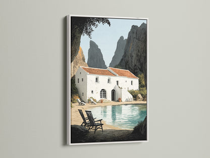 Framed coastal villa artwork with a white frame on a white wall. The bright frame enhances the seaside artwork. Ideal for a clean contemporary look. Perfect for living rooms bedrooms and beach houses. This artwork brings azure water views to your home.