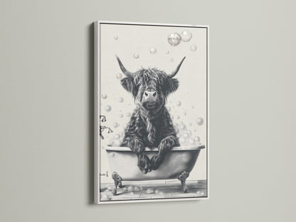This bathroom wall art features a highland cow enjoying a bubble bath. The black and white cow print is framed in a clean white frame. This funny animal print is perfect for a modern farmhouse bathroom. Elevate your restroom decor with this cute cow artwork.
