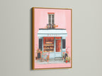 Artwork in a gold frame. The art portrays a charming bakery with pink walls and a blue storefront. The gold frame adds a touch of luxury and sophistication. This artwork is ideal for enhancing your interior with a hint of glamour and timeless style.