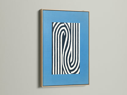 Abstract line art print displayed in an oak frame. This blue modern wall art enhances any room. The minimalist optical illusion canvas adds depth. Perfect for office decor or modern home styling. Explore our framed artwork options now.