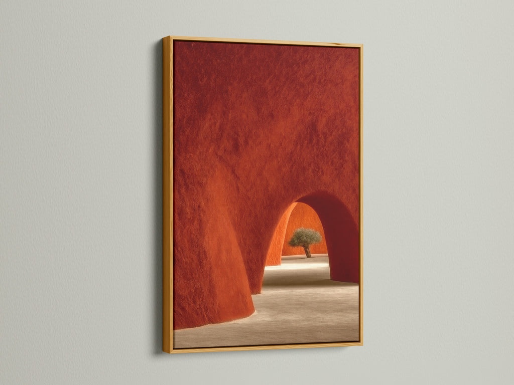 Gold Frame featuring Desert Architecture Canvas Artwork. The artwork showcases terracotta adobe arches. It is ideal Southwestern minimalist decor for the bedroom. The gold frame brings warmth and elegance to the art.