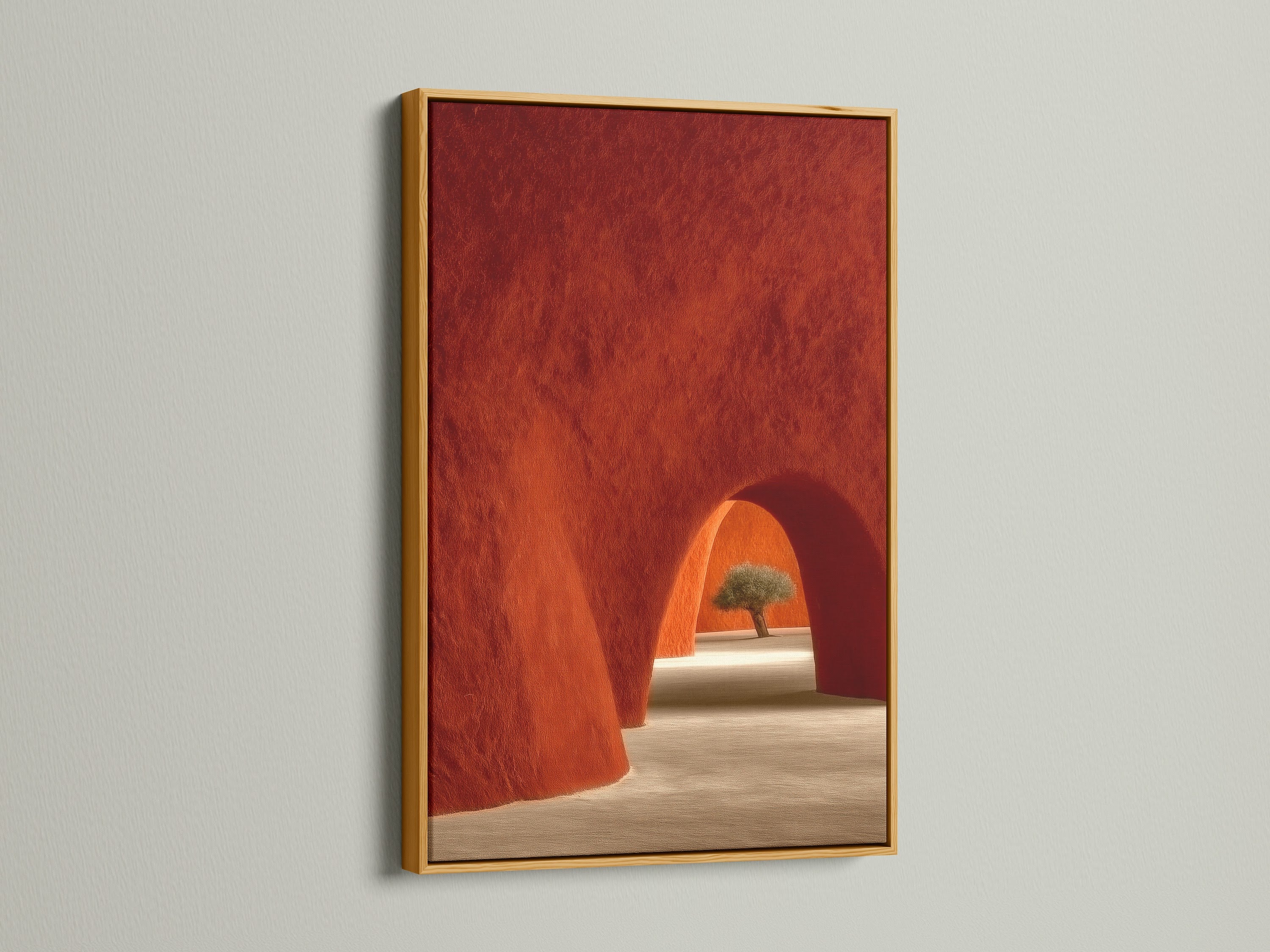 Gold Frame featuring Desert Architecture Canvas Artwork. The artwork showcases terracotta adobe arches. It is ideal Southwestern minimalist decor for the bedroom. The gold frame brings warmth and elegance to the art.
