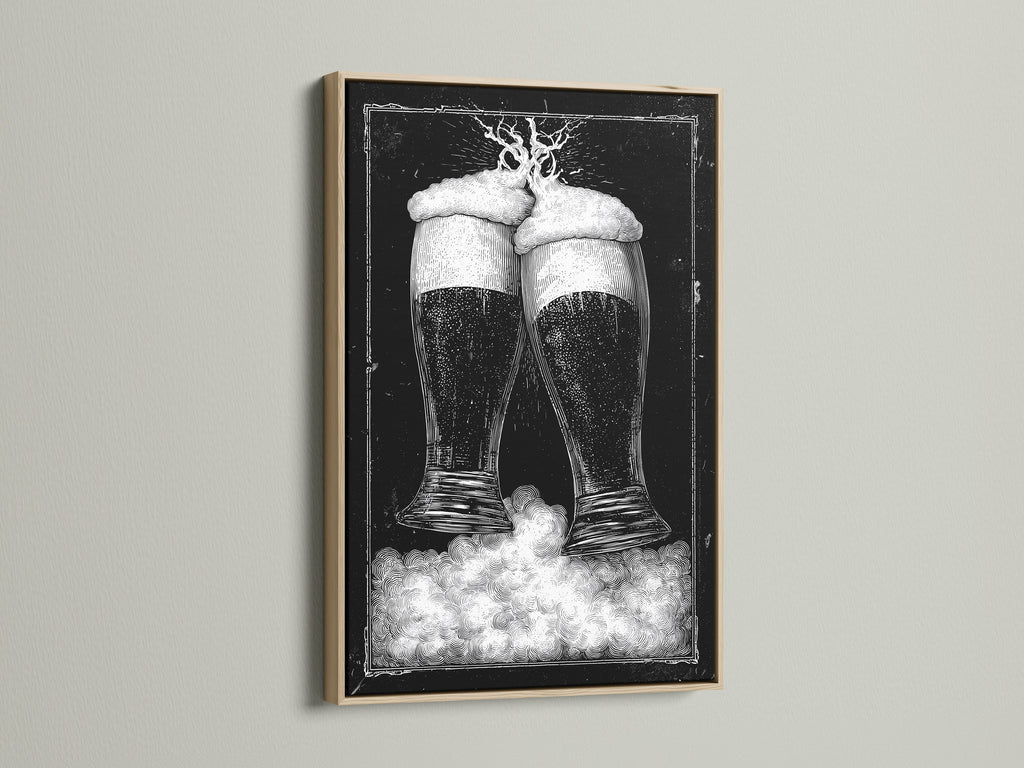 Oak frame artwork. The art features two beer glasses in black and white tones. This piece is mounted on a clean white wall. The frame is a natural oak color. Discover framed artwork options to enhance your space. Explore our selection today for the perfect piece.