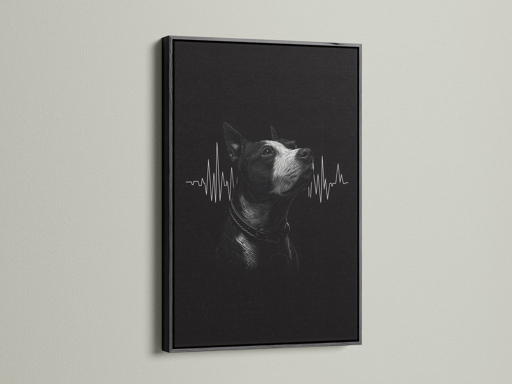 A dog heartbeat artwork is sharply displayed in a black frame. The dark frame provides a bold contrast for the black and white art. This framed print is perfect for a modern veterinary office.