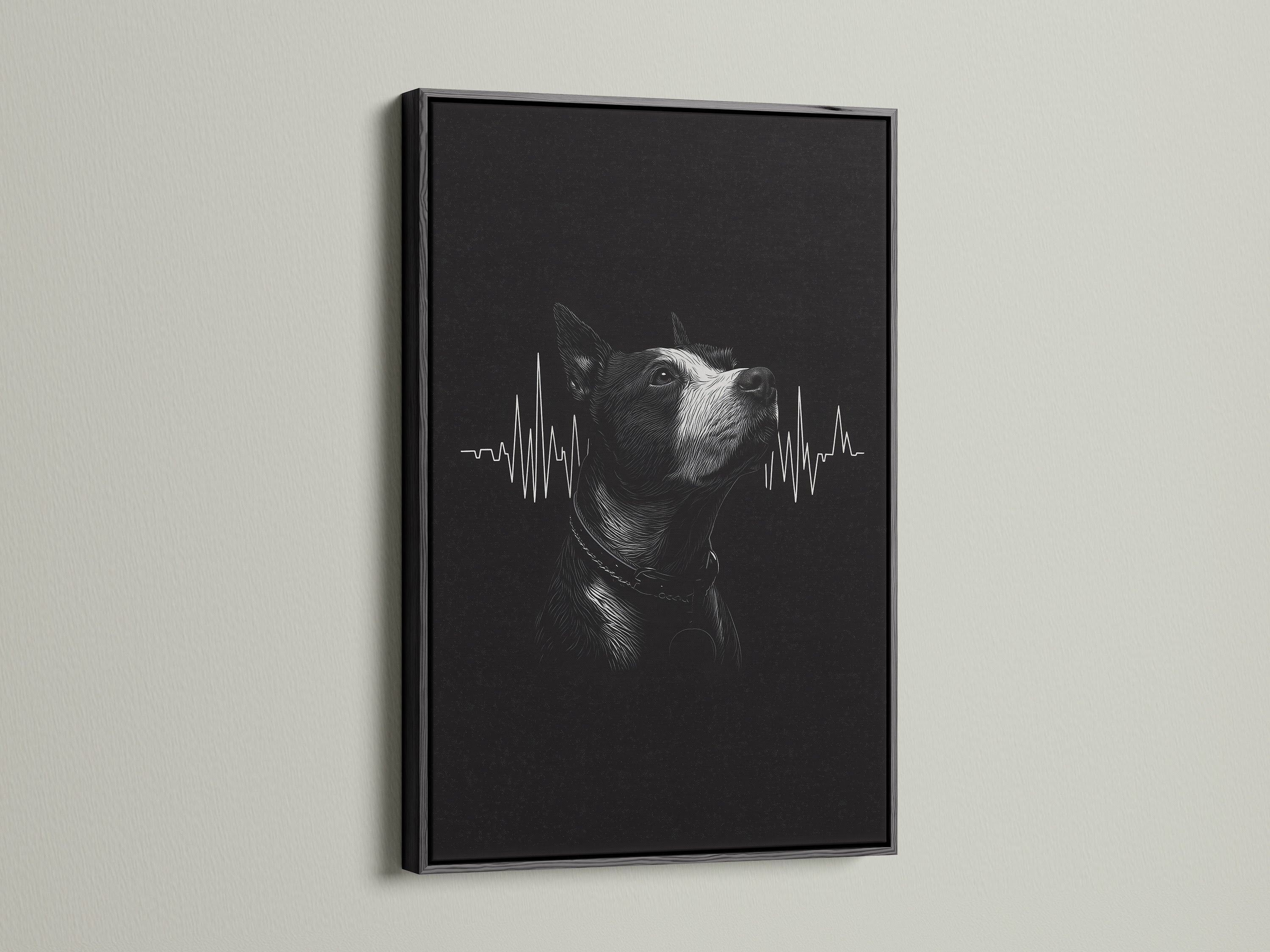 A dog heartbeat artwork is sharply displayed in a black frame. The dark frame provides a bold contrast for the black and white art. This framed print is perfect for a modern veterinary office.