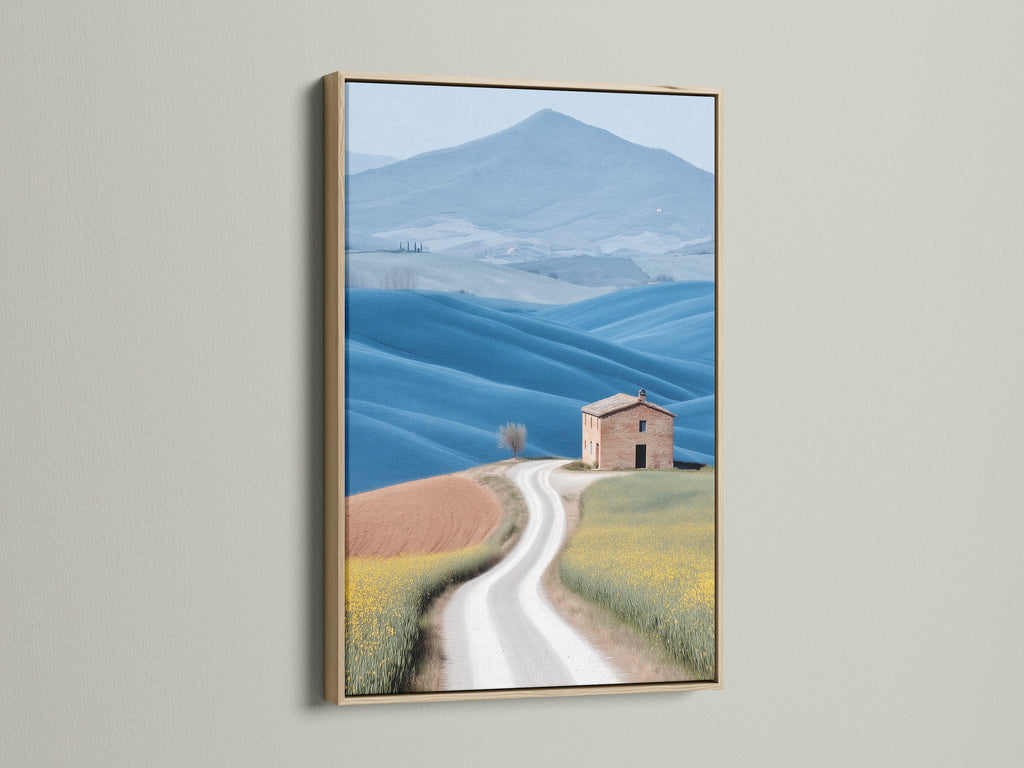 Tuscan Landscape canvas print in an oak frame. The art showcases rolling hills and a charming farmhouse scenery. Ideal for adding a rustic touch to your living room or bedroom. The oak frame enhances the artwork's warm tones. Perfect for those seeking farmhouse wall art.
