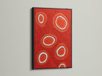 This black frame accentuates the bold abstract red art. The geometric canvas print is a modern wall decor statement. The circle artwork pops against the dark frame. It adds sophistication to any living space. Ideal for those seeking a contemporary art piece. The black frame provides a sleek finish.