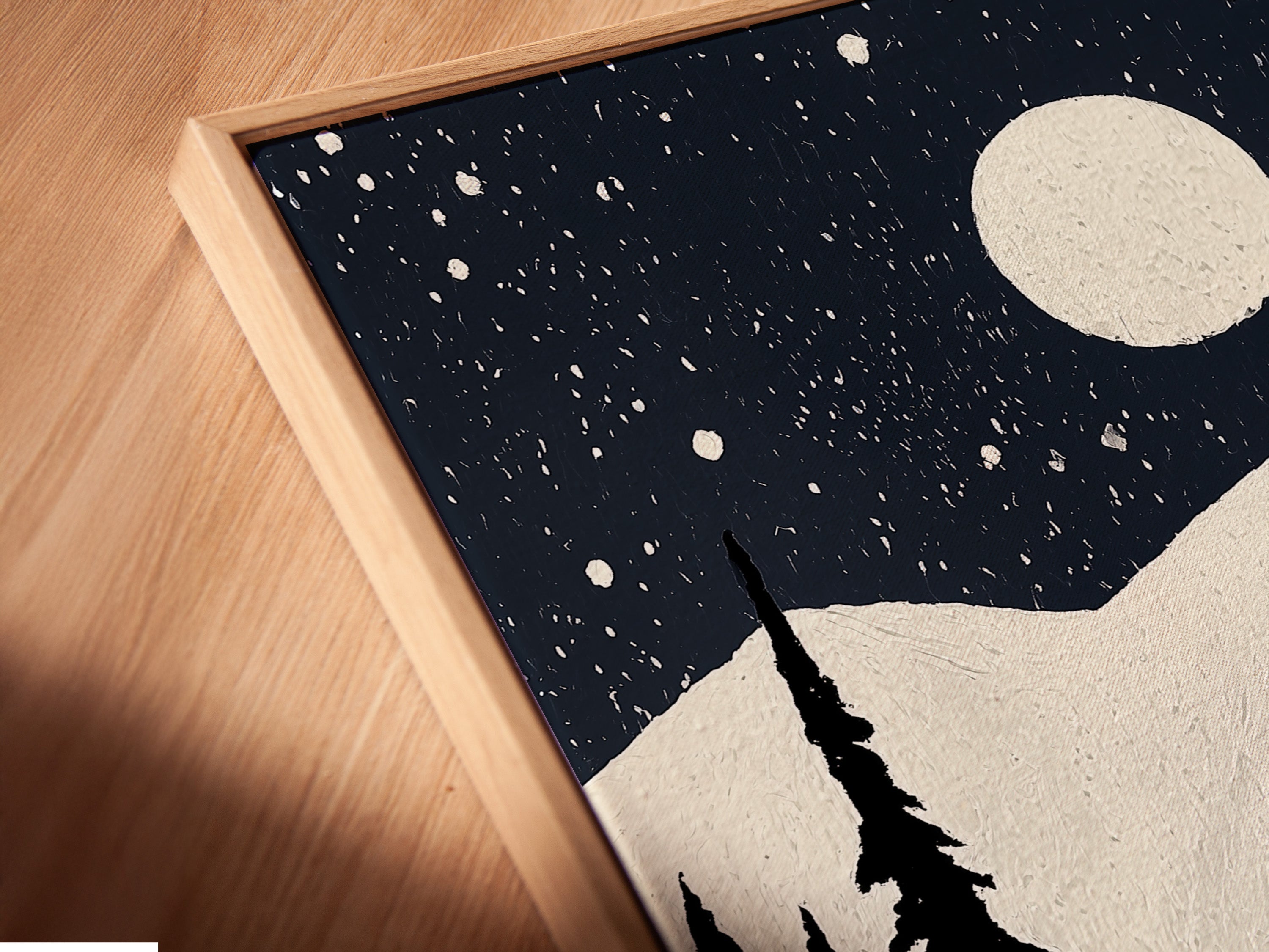 See the fine details of our canvas print in a floating frame. The angled close-up highlights the texture and quality. Perfect for showcasing winter mountain art. This ski lift poster is ideal for lodge decor. The snowy night scene wall art is ready to hang and enjoy.
