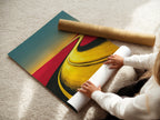 A woman is carefully unrolling a fine art poster paper. The paper is ready for a desert road artwork print. This landscape canvas is perfect for earth tone decor. The abstract wall art will soon be an office art print. The modern artwork is ideal for minimalist spaces and travel art.