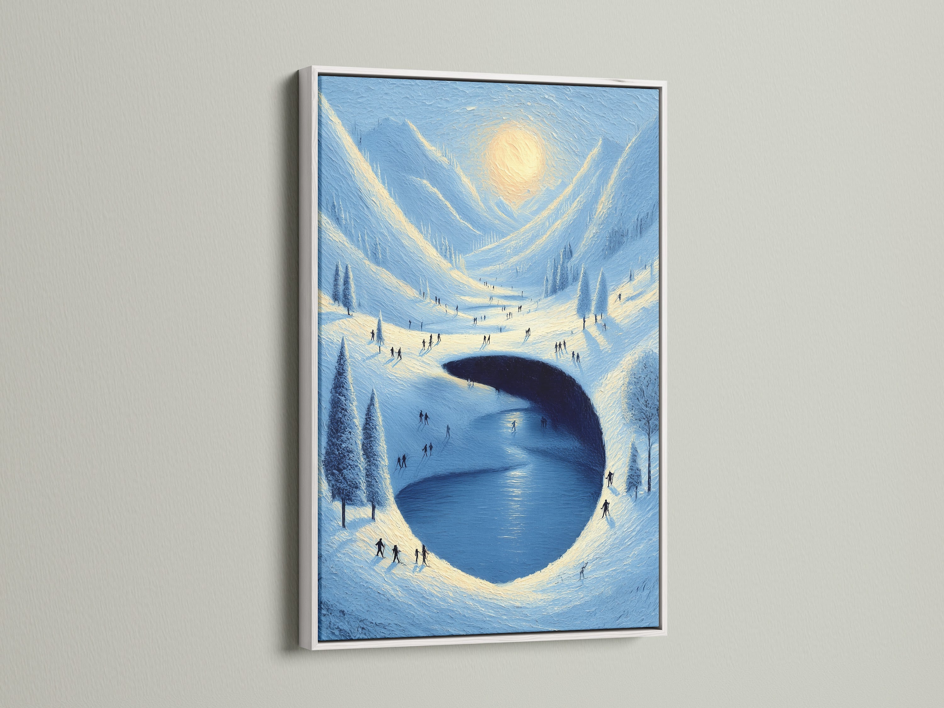 This image shows winter wall decor. A white frame surrounds a blue and white nature canvas print. The snowy landscape art brings a cold weather aesthetic to any room. It is perfect for a minimalist style.