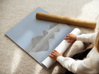 A woman rolls a fine art poster paper. The fine art paper ensures high-quality prints. This process preserves the artwork's integrity. Experience the beauty of fine art prints. The poster paper enhances colors and details. Discover our selection of premium papers today.