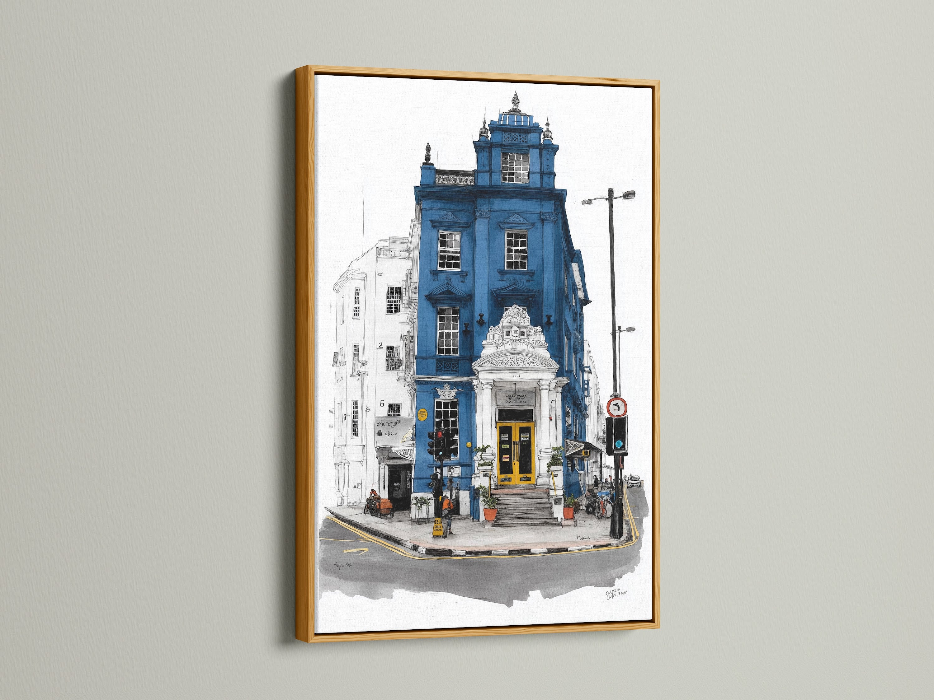 London Architecture Art in a gold frame. The artwork showcases a blue building with a yellow door. This city scene print adds sophistication to any room. Explore our selection of London souvenirs and travel art.