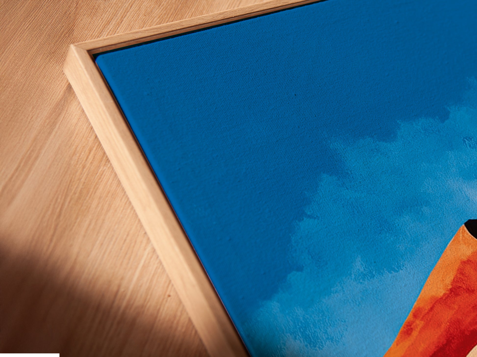 Get a close-up view of our canvas print in a floating frame. The angled shot highlights the depth and texture of the artwork. This Abstract Desert Landscape print enhances any room's ambiance. Its Southwestern decor and modern canvas art make it a standout piece.
