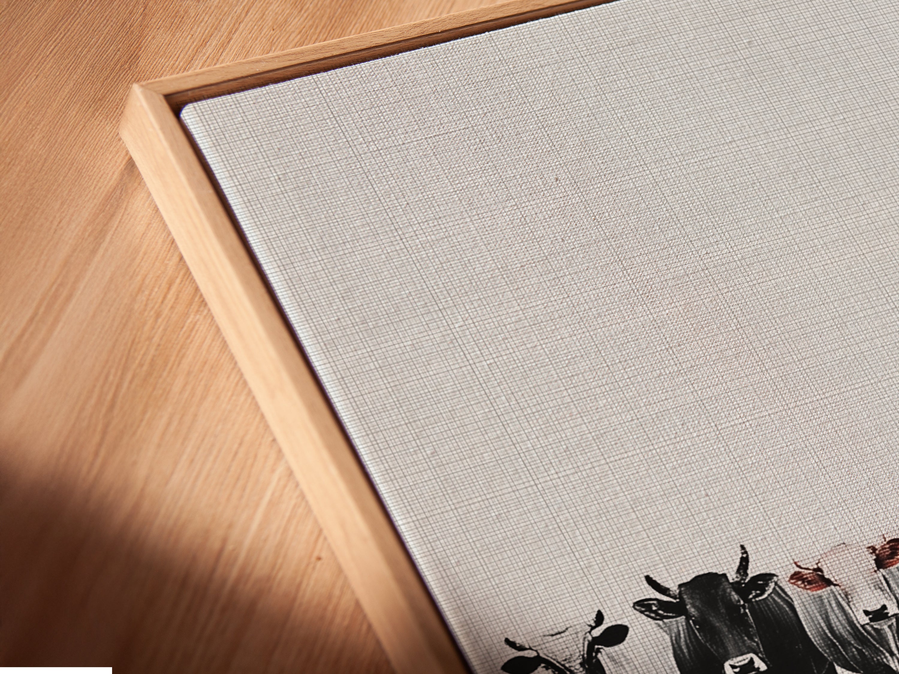 Angled close up of a cattle canvas print in a floating frame. Experience the beauty of farm animal artwork. The floating frame enhances the rustic country style. Shop floating frame art.