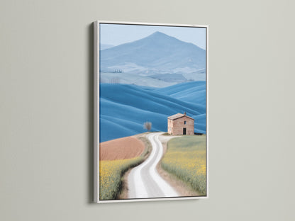Tuscan Landscape artwork in a white frame. This fine art print captures the beauty of the Italian countryside. The white frame provides a clean modern look. It complements the yellow and blue hues in the artwork. Consider this piece for your home decor prints.