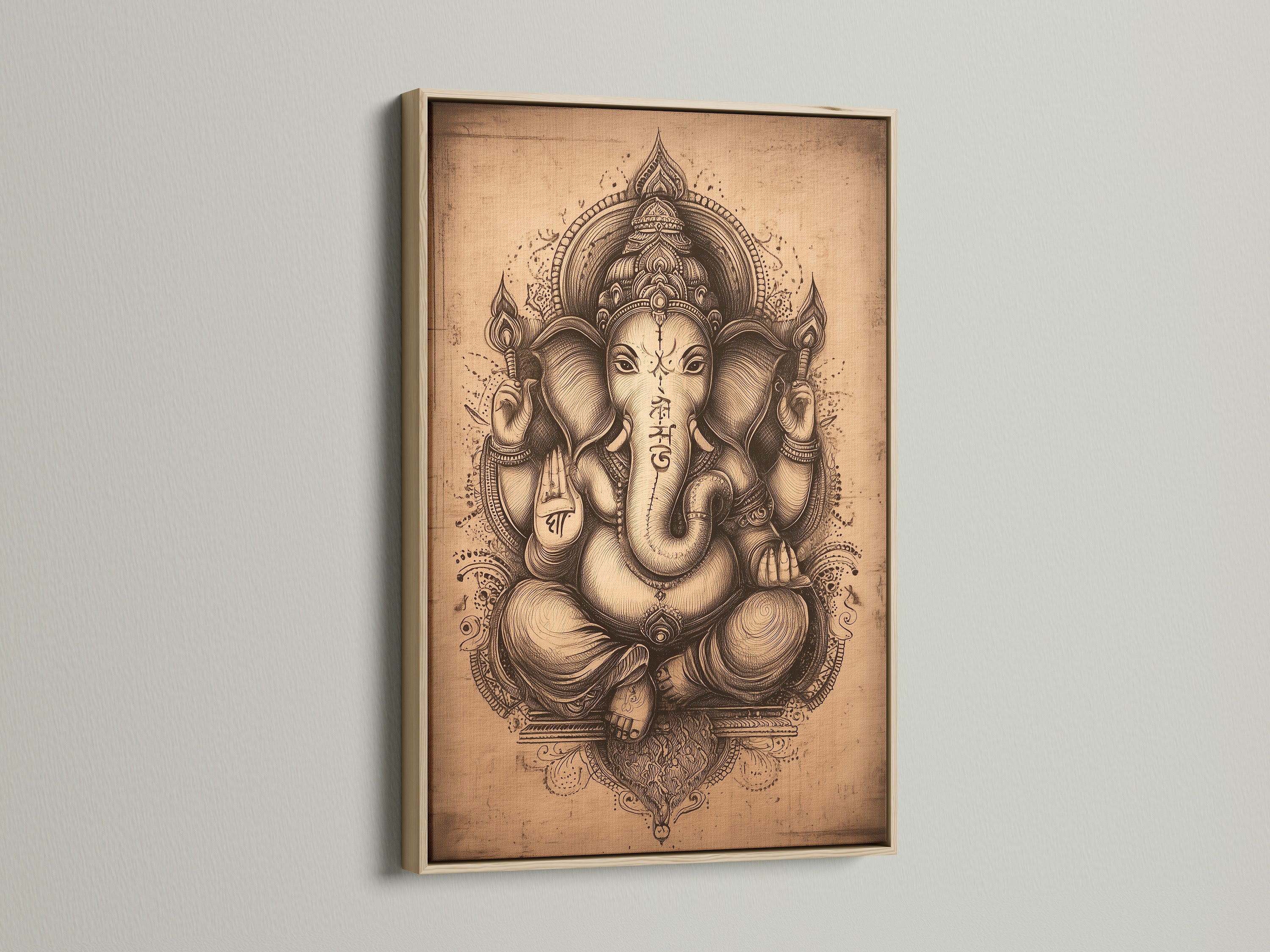 Close up of Ganesha Wall Art in an oak frame. This Hindu canvas print brings a spiritual touch to any space. The Elephant God artwork is ideal for meditation room decor or a yoga studio. A beautiful piece.
