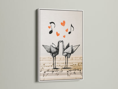 Origami cranes artwork framed in white. The artwork depicts two origami cranes on a music sheet backdrop. Floating hearts and music notes create a love theme. The white frame offers a clean modern look.