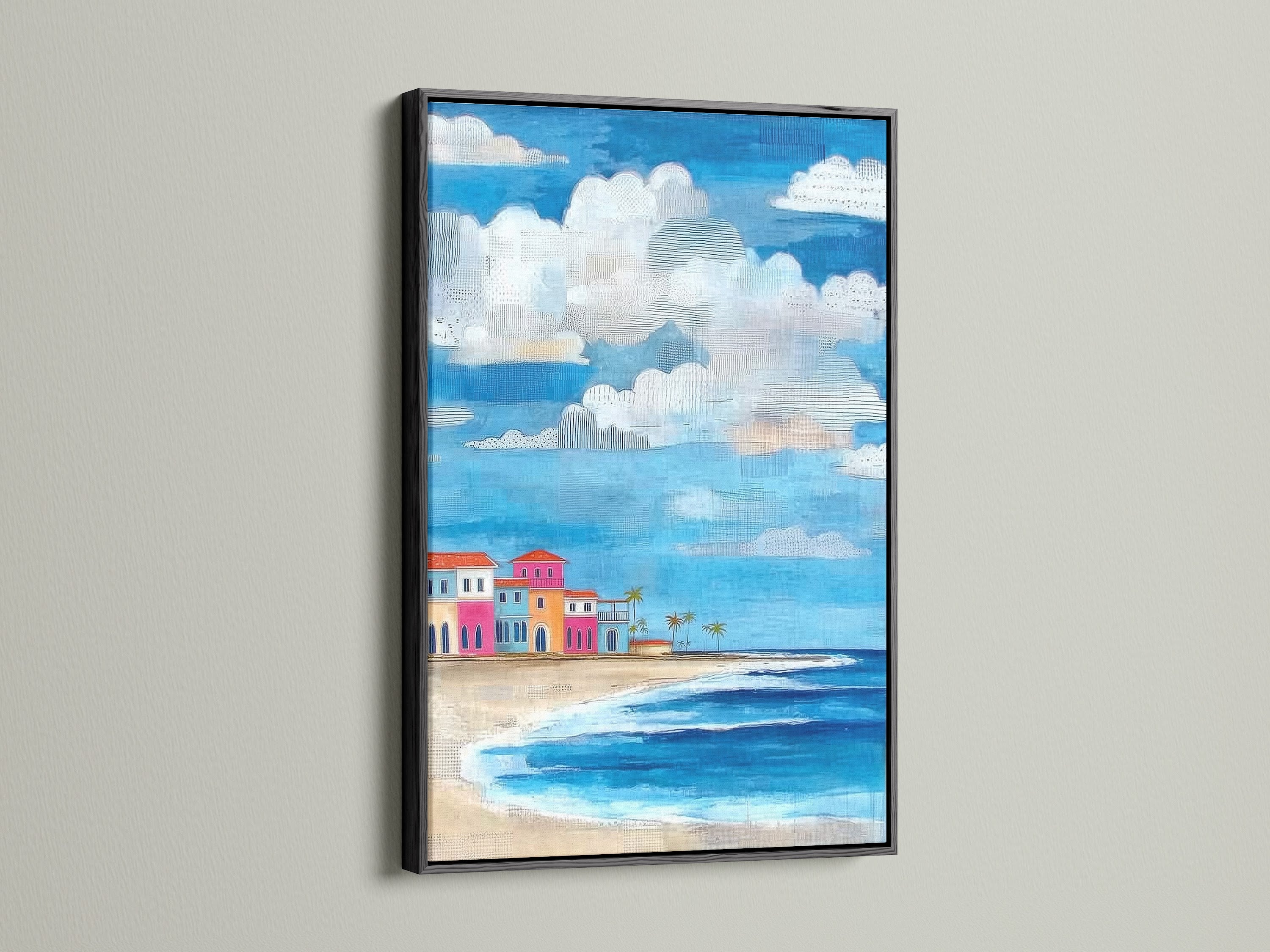 Coastal beach artwork with a black frame. The artwork depicts colorful beach houses. This tropical seascape wall art is striking. The black frame adds a bold statement to the piece.