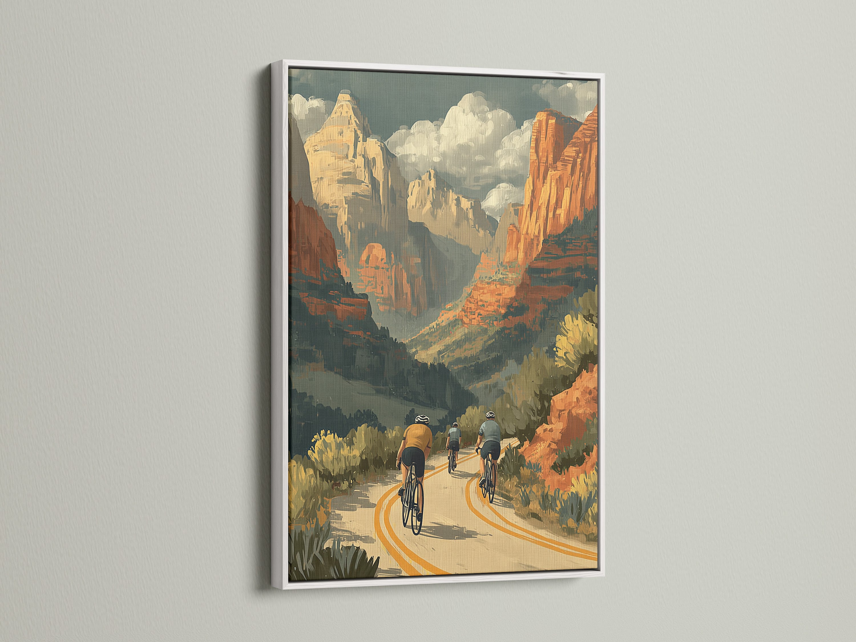 This cycling wall art features a stunning desert canyon. The print is framed in white for a clean look. The retro travel poster brings a sense of adventure. Perfect for a home office or living room. The white frame enhances the artwork's vibrant colors. A great piece of Southwestern art.
