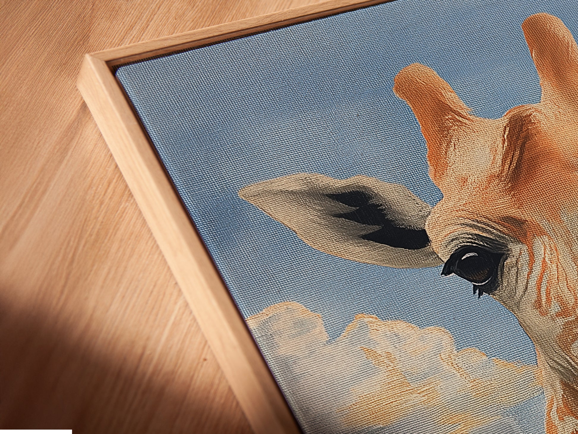 A close-up angled view reveals the exquisite detail of a canvas print in a floating frame. The giraffe skyline artwork appears to hover adding depth and sophistication to this playful piece.