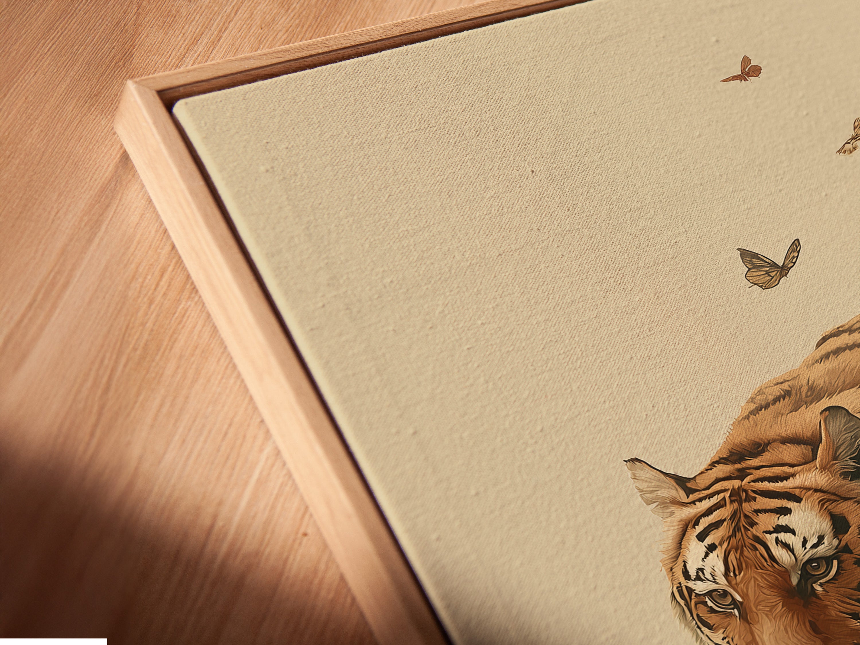 A close-up angled view shows a canvas print of vintage tiger artwork in a floating frame. The botanical tiger and floral elements are beautifully displayed. The floating frame gives the artwork a modern and sophisticated look. This traditional wildlife canvas is perfect for showcasing oriental prints in any room.
