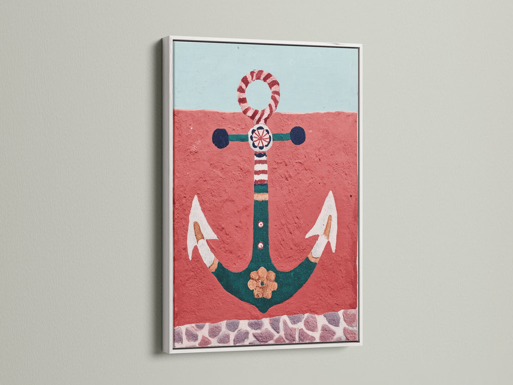 White frame highlights the anchor artwork's vibrant colors. This nautical decor brings a coastal touch. The sea print creates a relaxing beach house atmosphere. Red and teal artwork adds a pop of color. This ocean canvas is ideal for vacation homes and seaside decor. A perfect nautical print.