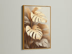 Monstera plant artwork featured in a gold frame. This luxurious touch elevates the botanical print. The tropical leaf artwork adds warmth and elegance. Its gold accents complement boho and eclectic styles. It is ideal for creating a focal point.