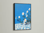 This floral canvas art stands out in a sleek black frame. The azure blue wall art is a botanical print that adds a touch of elegance to any entryway. This flower artwork is a modern accent.