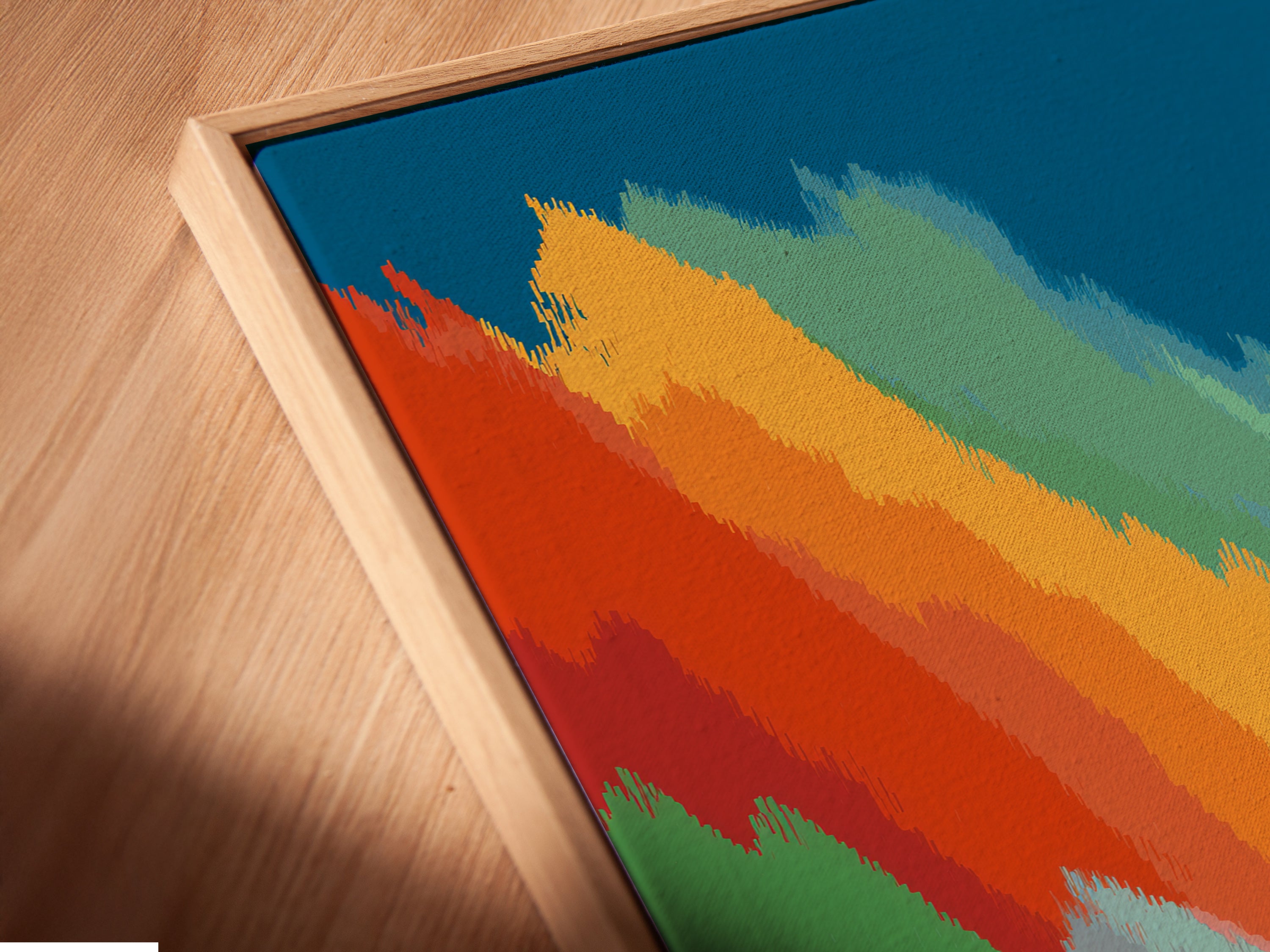 An angled close-up reveals the exquisite detail of a canvas print in a floating frame. The floating frame enhances the artwork's depth and dimension. This modern artwork is an ideal focal point for any room. This colorful ocean art will elevate your interior design.