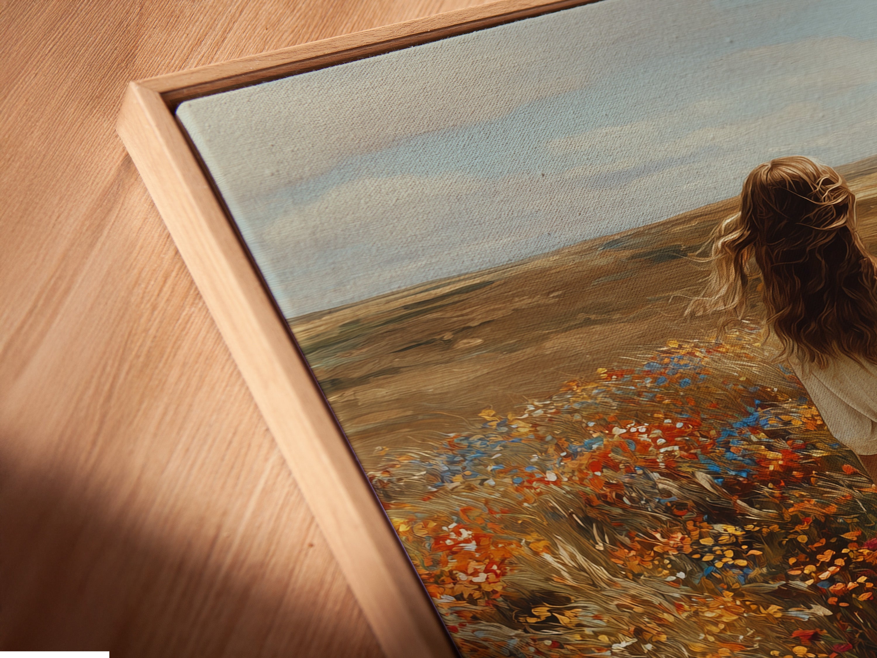 Angled close-up of a canvas print in a floating frame. The artwork features a woman walking through a field of flowers. The floating frame provides a modern look. It enhances the art's visual appeal. Explore the beauty of canvas prints. Transform your home with framed artwork.