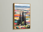 The Tuscan Landscape artwork is beautifully displayed in a gold frame. This colorful wall art captures the essence of the Italian countryside. The gold frame enhances the artwork's vibrancy. Add a touch of elegance to your home decor with this stunning landscape artwork. Perfect for any space.