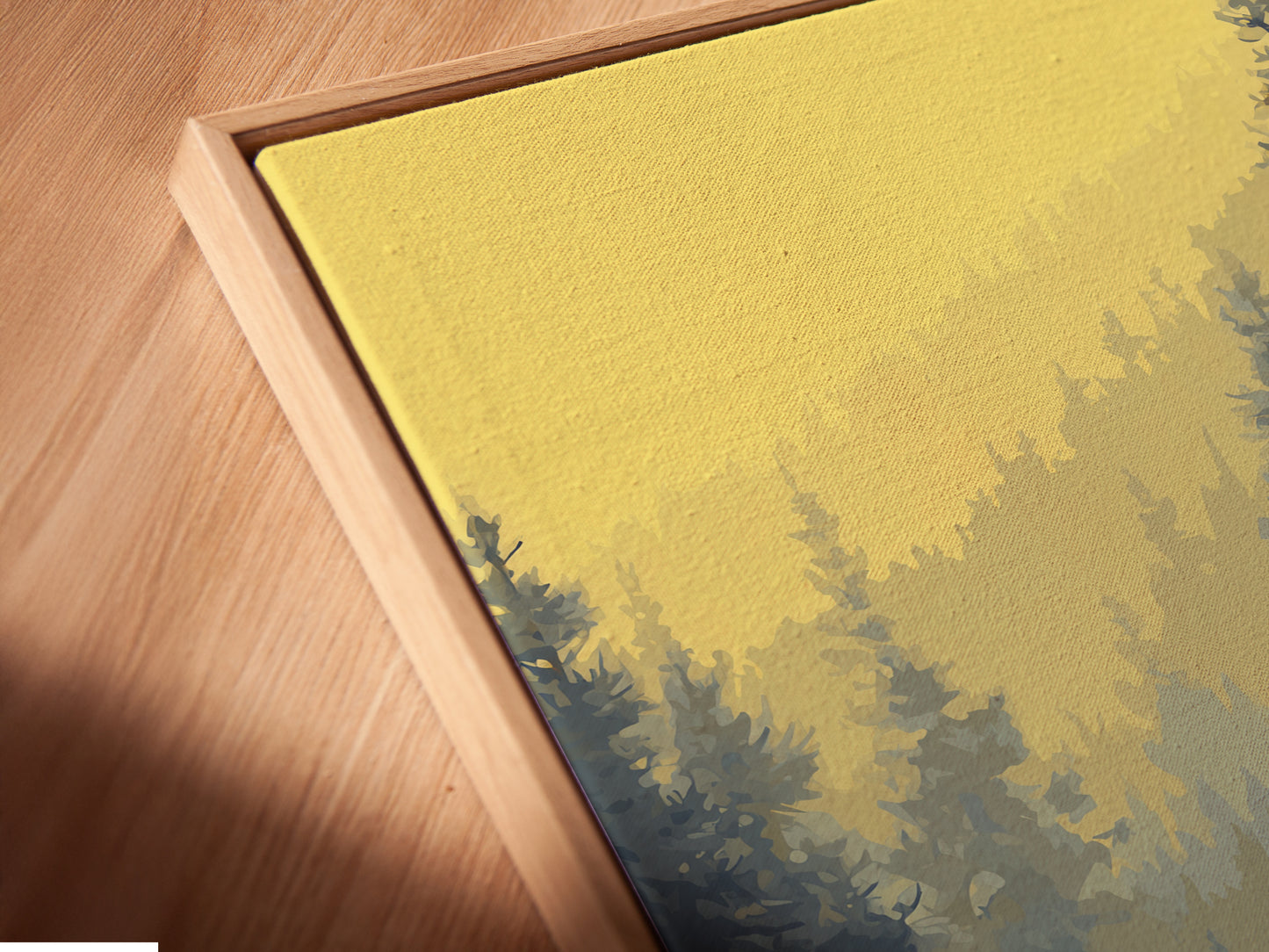 A close-up angled view of a canvas print in a floating frame. The artwork shows a bear and canoe in an autumnal forest. This serene nature print is perfect for cabin wall decor. It adds a touch of the outdoors.
