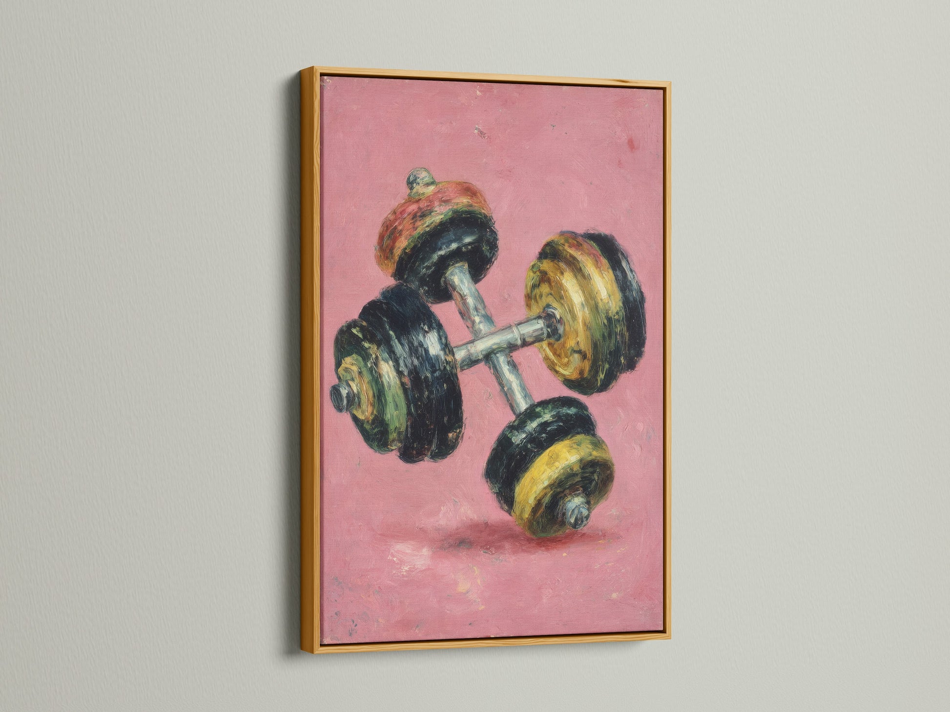 This vintage dumbbell artwork print is showcased in a gold frame. The retro fitness wall art features a pink canvas. This motivational workout art is perfect for home gyms. Elevate your space with this fitness art.