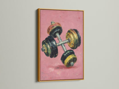 This vintage dumbbell artwork print is showcased in a gold frame. The retro fitness wall art features a pink canvas. This motivational workout art is perfect for home gyms. Elevate your space with this fitness art.