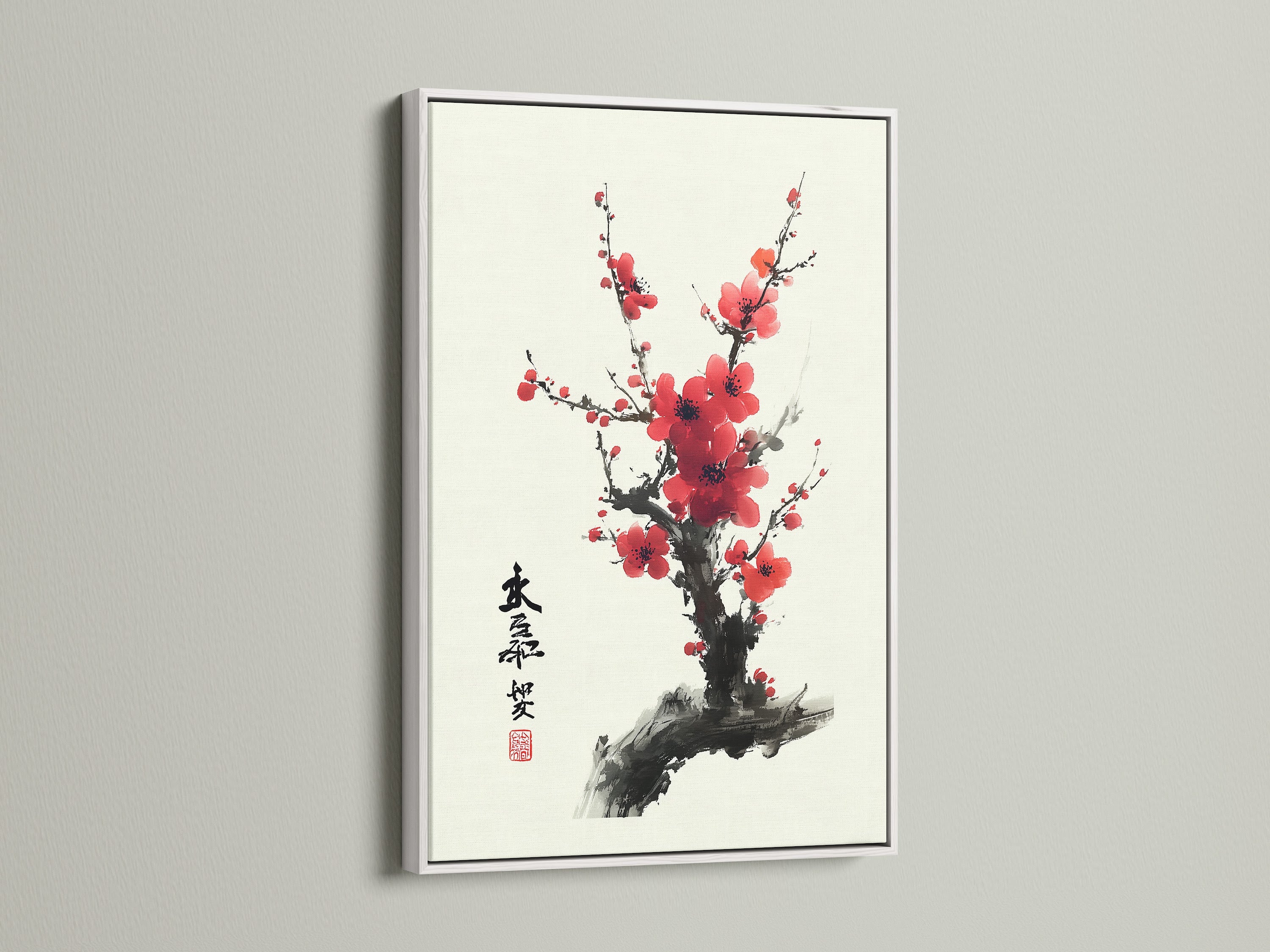 Artwork with a white frame is displayed. The white frame offers a clean and modern look. It complements the artwork while brightening the space. The art is featured on a white wall. A beautiful cherry blossom artwork is within the frame.