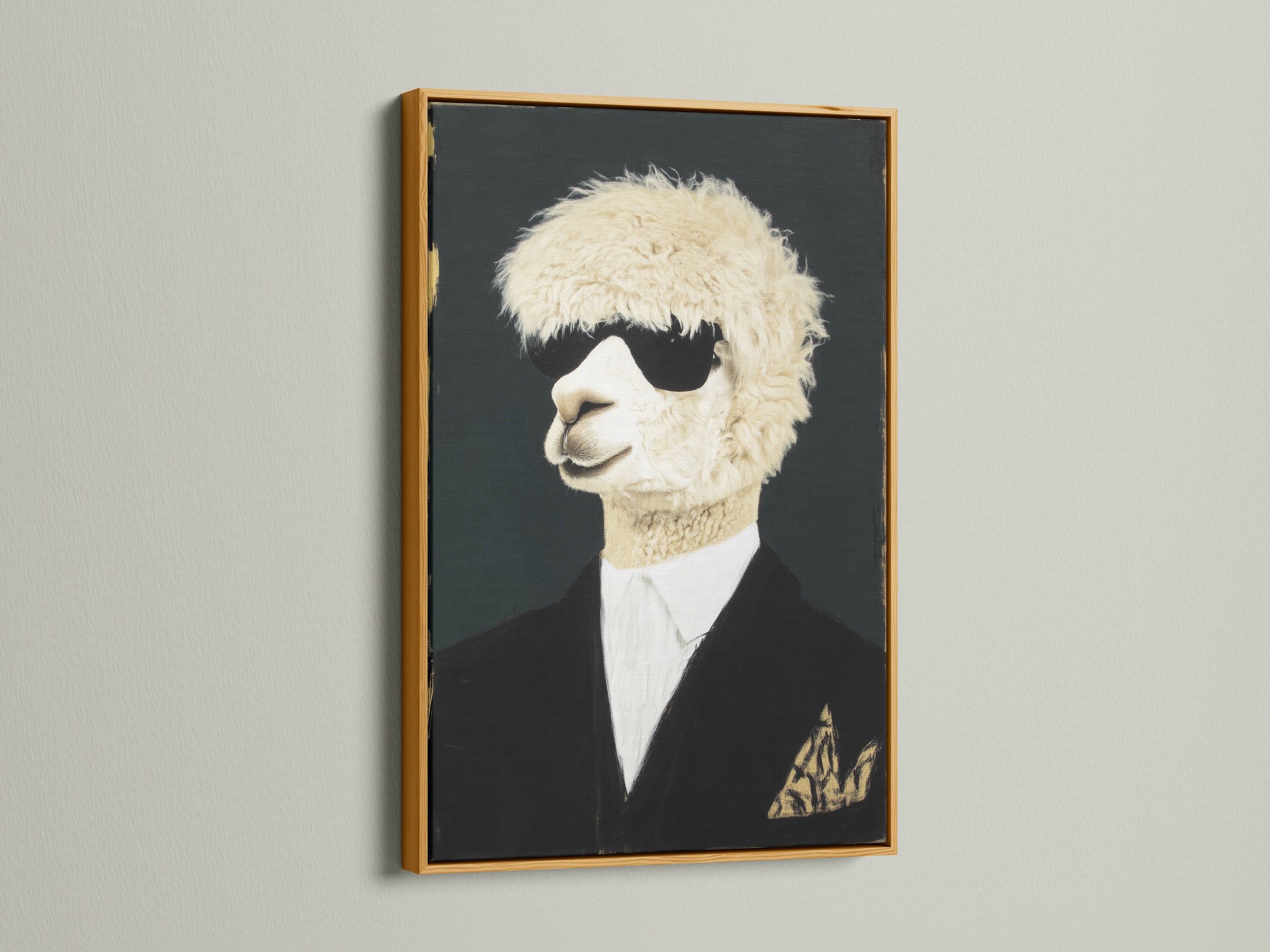Cool Llama Art Print in a gold frame hangs on a white wall. This quirky animal wall art features a llama wearing sunglasses and a suit. The gold frame adds a touch of elegance. Perfect formal portrait canvas print for office wall decor.