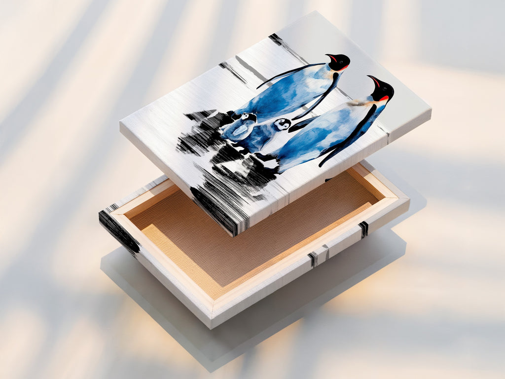 Stretched canvas print of a penguin family. This coastal wall decor is perfect for nurseries. The arctic wildlife canvas art makes a great gift for animal lovers. A blue and white winter wall art piece.