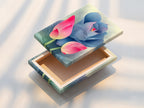 Close-up of a stretched canvas print featuring a pink and blue lotus flower artwork. Stretched canvas prints offer a ready-to-hang frameless presentation. Ideal for adding a modern botanical touch to any room. Discover the beauty of floral canvas artwork.