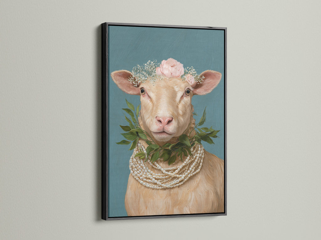 Framed whimsical sheep artwork with a floral crown and pearl necklace. This Country Wall Art is displayed in a black frame. Perfect Farm Animal Print for Nursery Wall Decor. The black frame makes a bold statement for your farmhouse decor.