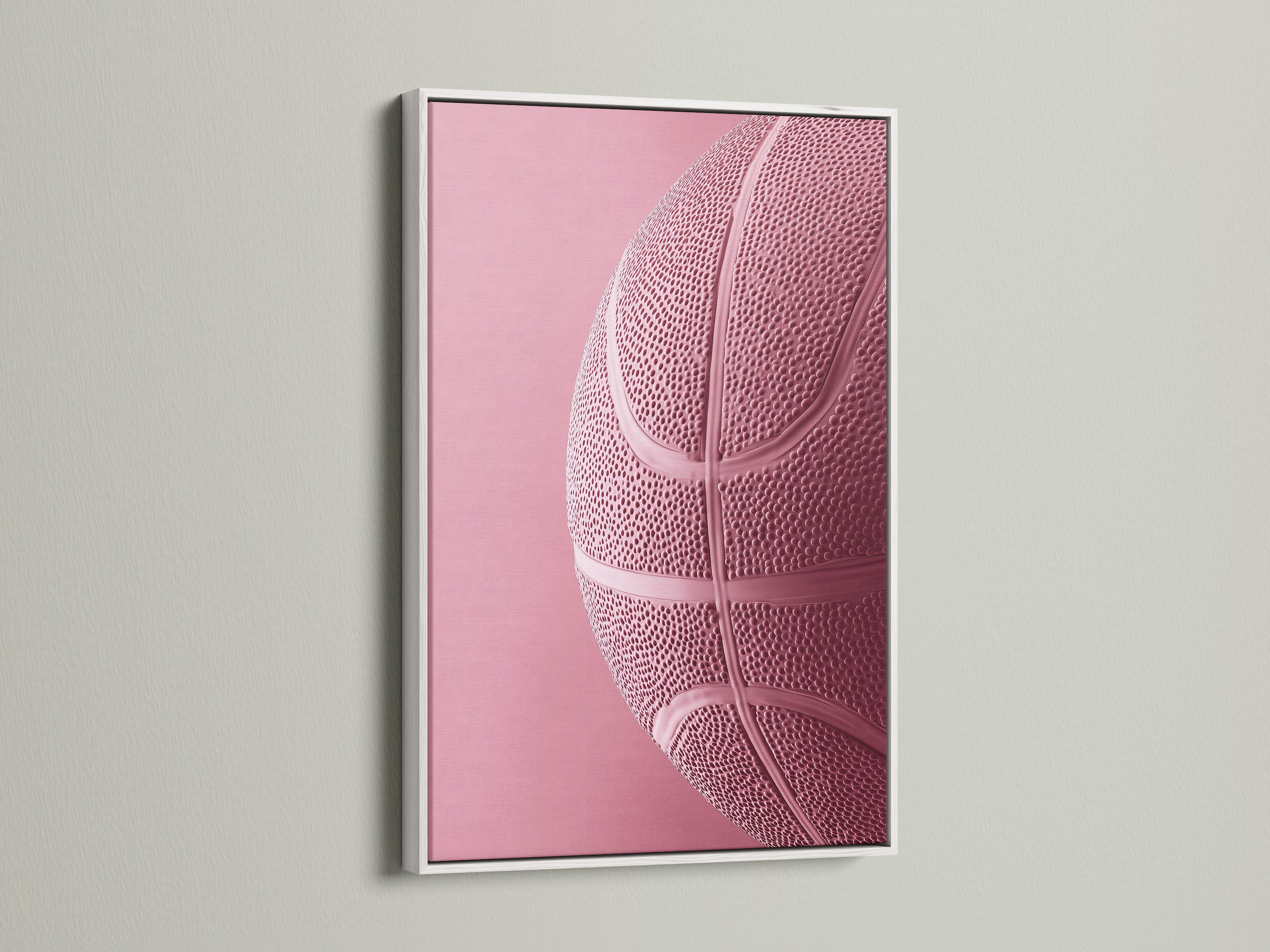 White frame on display. This frame showcases a pink basketball art print. The white frame offers a clean modern look. Its ideal for various interior styles. Transform your artwork with this frame.