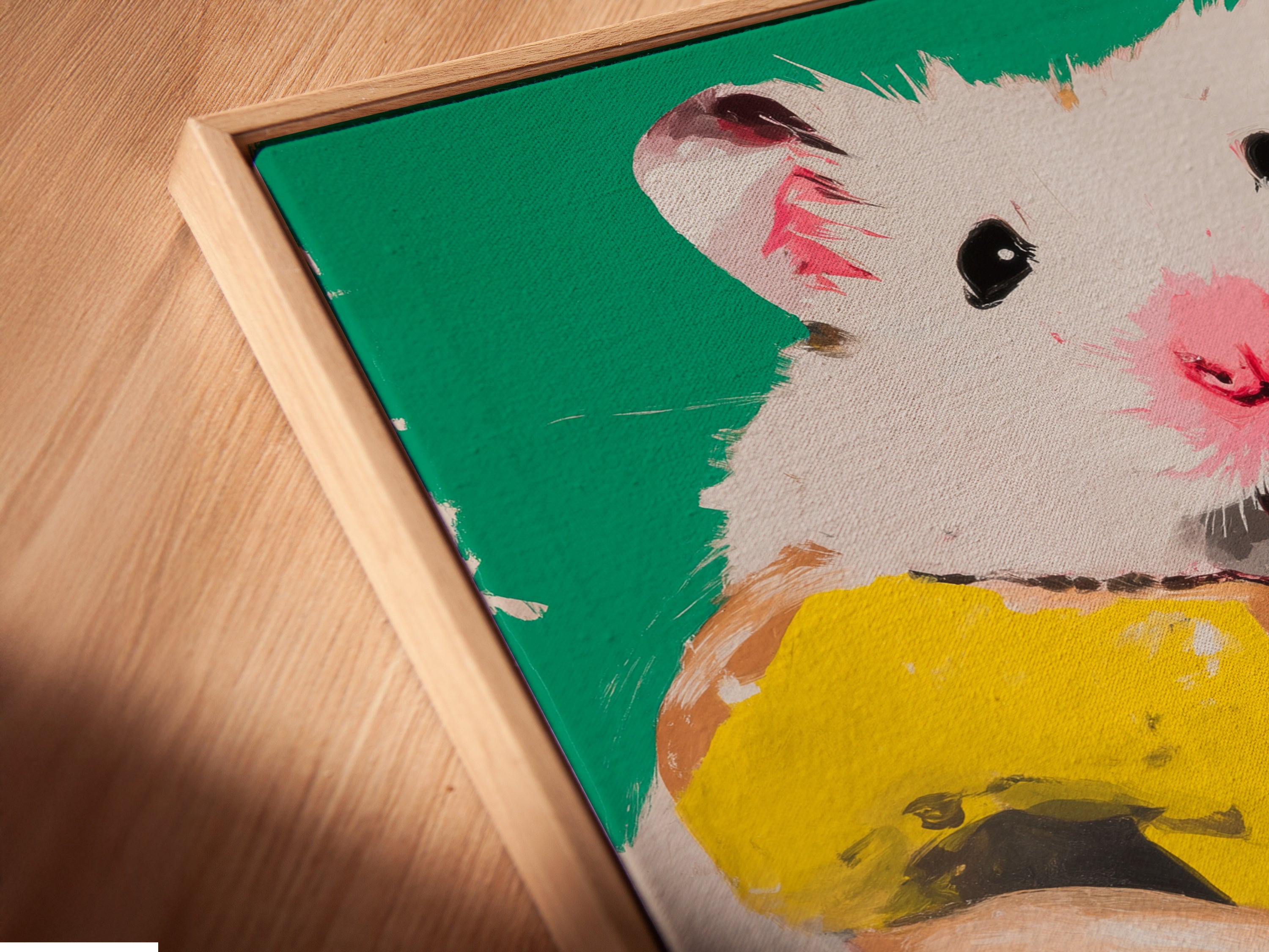 Close-up of the hamster donut art in a floating frame. It showcases the art's detail. This cute animal art is perfect for children's rooms. The floating frame enhances this colorful canvas artwork.
