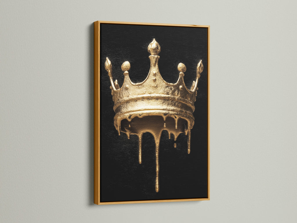 Melting Crown artwork with a gold frame. The artwork features a gold melting crown on a black background. The gold frame complements the artwork's luxurious feel. Find the perfect piece of modern royalty art.